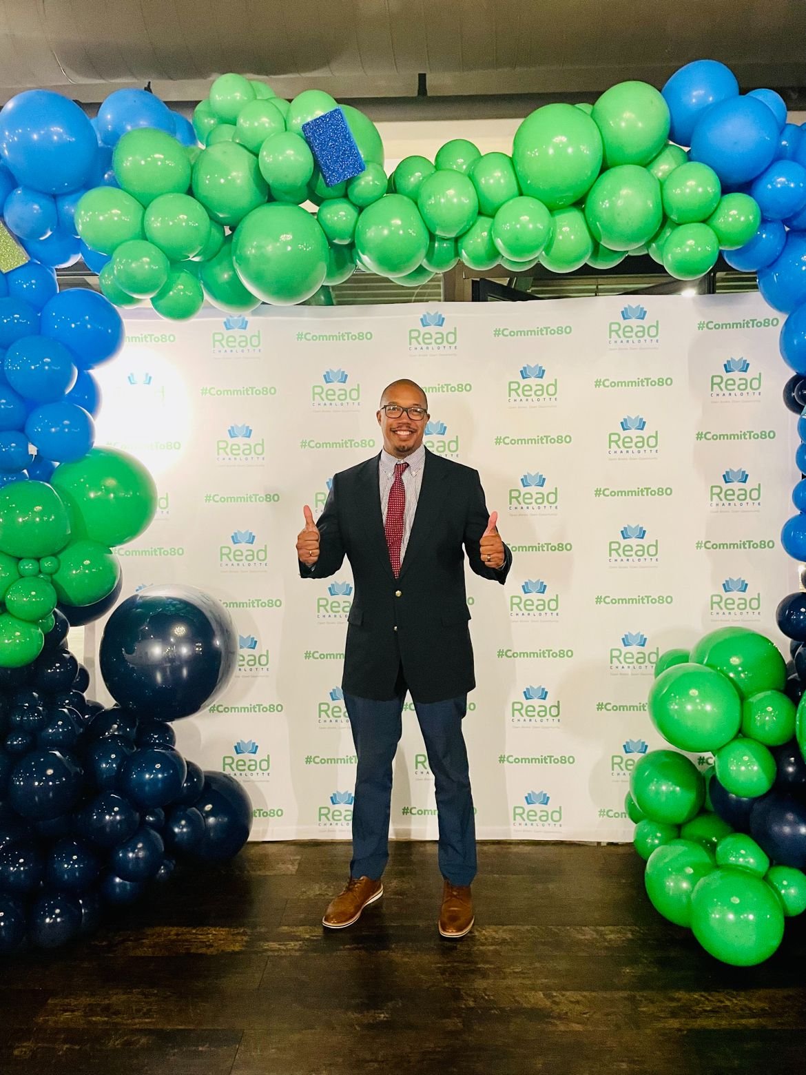Damon Willis standing at a community education event